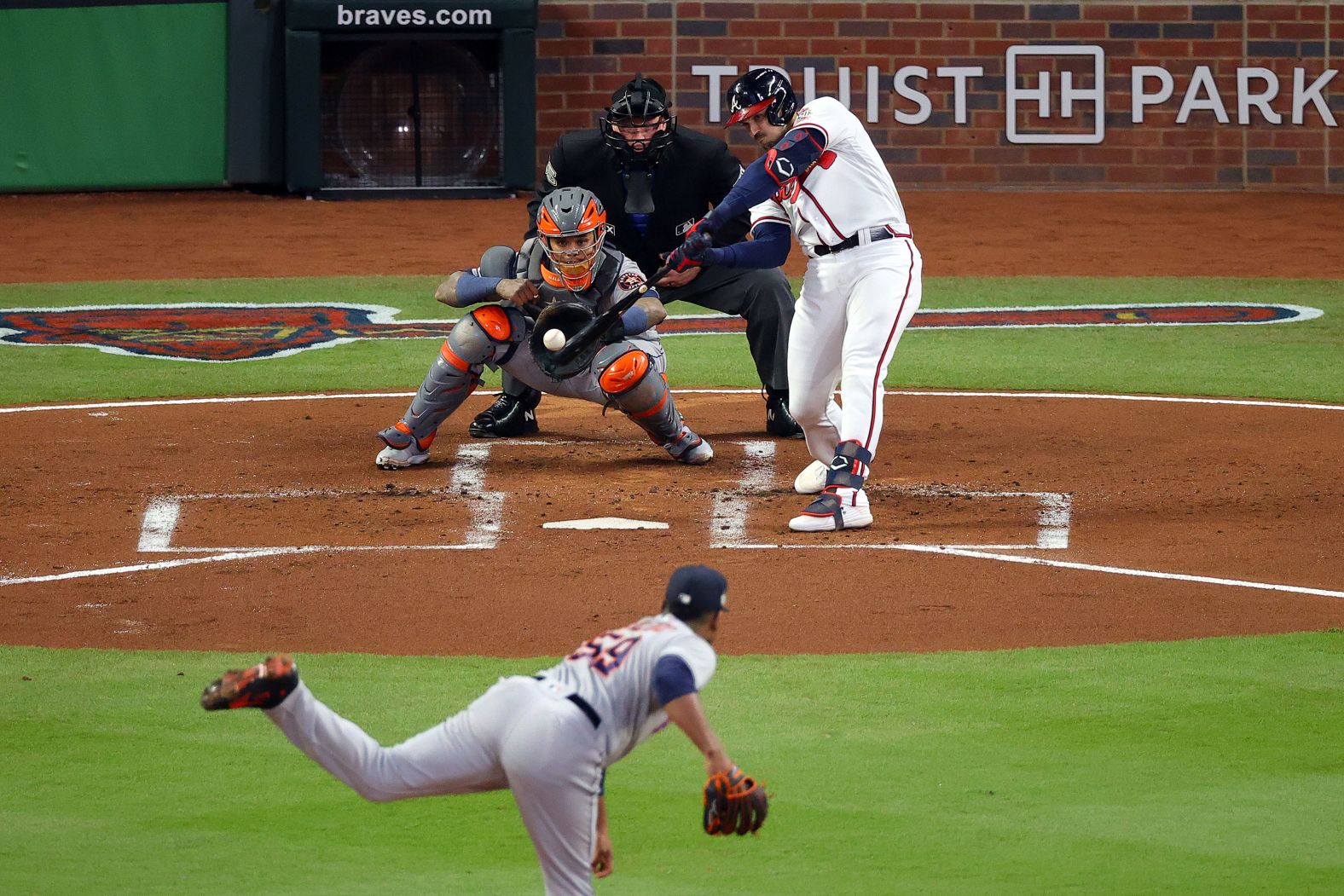 Adam Duvall of the Atlanta Braves hits a grand slam home run during the first inning of Game 5.