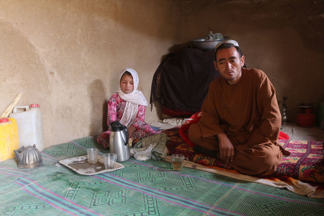 Parwana Malik, 9, and her father Abdul, in their home at a camp for internally displaced people in Afghanistan's Badghis province.