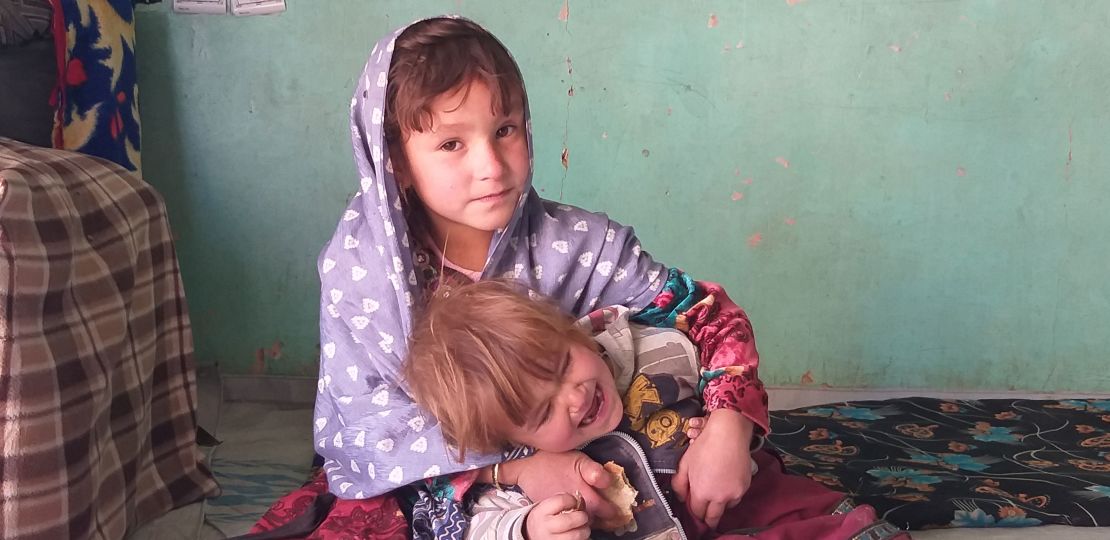 Zaiton, 4, plays with her brother at their home in Ghor province, Afghanistan.
