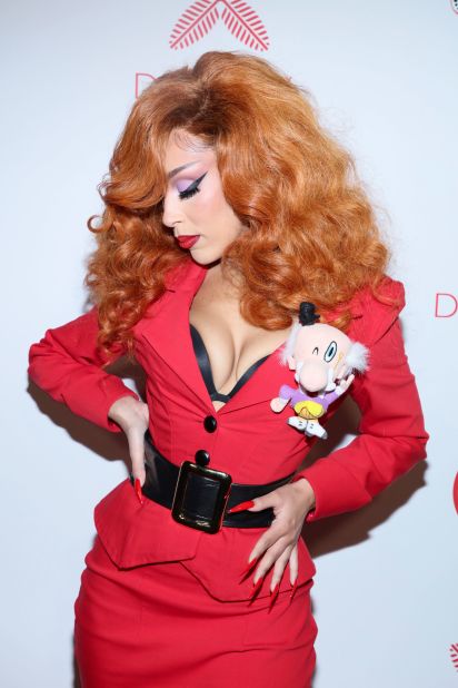 Rapper Doja Cat attended a Halloween party dressed as Miss Bellum from the "Powerpuff Girls," along with a Mr. Mayor stuffed toy pinned to her lapel.