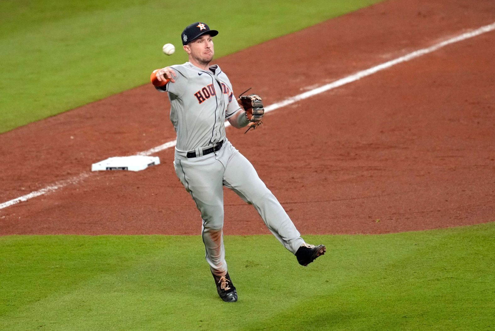 Astros third baseman Alex Bregman throws to first base for the out during Game 5 on Sunday, October 31.