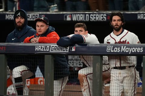 Members of the Atlanta Braves watch during the ninth inning.