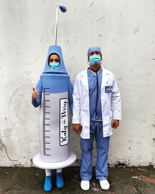 Katy Perry dressed as a syringe, while Orlando Bloom sported PPE as a doctor.