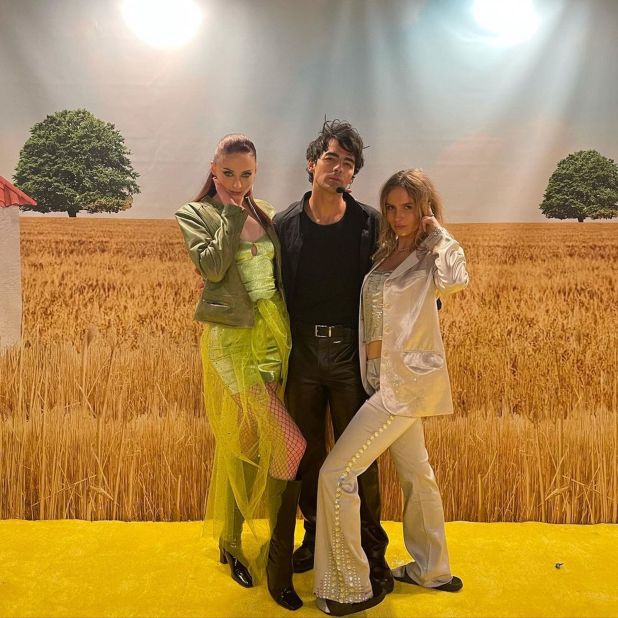 Joe Jonas gave his past Disney days a nod and celebrated Halloween dressed as Paolo from "The Lizzie McGuire Movie," alongside Sophie Turner and Olivia De Jonge as Lizzie McGuire and her doppelganger Isabella. 