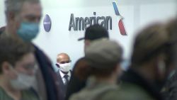 People wait in line at an American Airlines counter at an airport in Charlotte, N.C. on Sunday, Oct. 31, 2021. The airline has canceled more than 800 flights on Sunday, or nearly 30% of its schedule for the day.