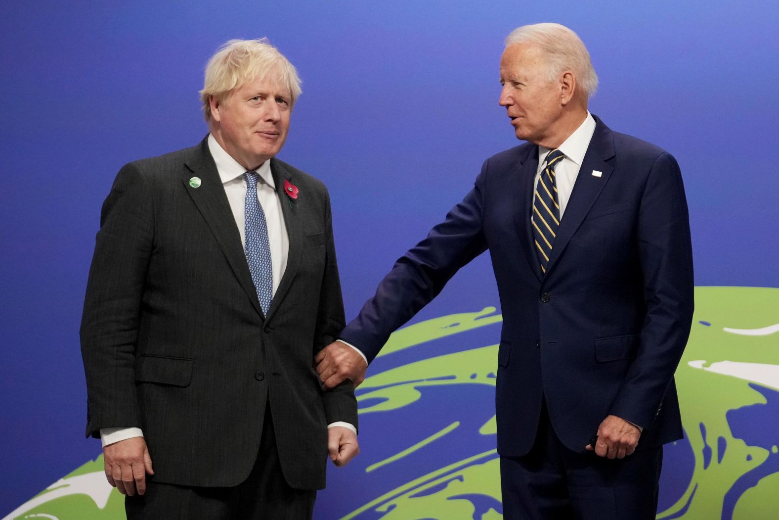Johnson greets Biden at the start of COP26.
