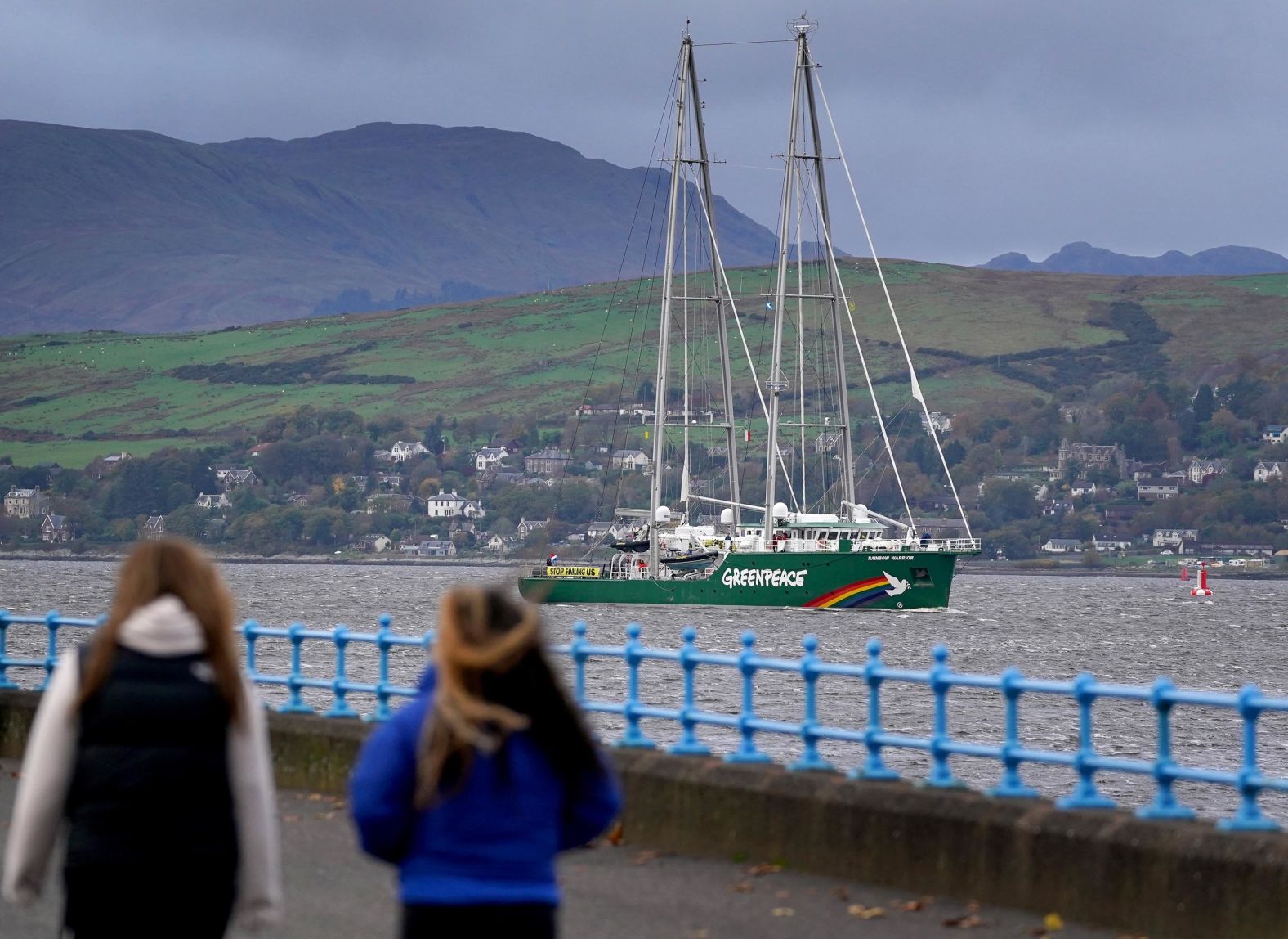The Greenpeace ship Rainbow Warrior makes its way up the River Clyde, near Greenock, Scotland, on the first day of COP26. The ship was carrying four young climate activists from areas affected by climate change.