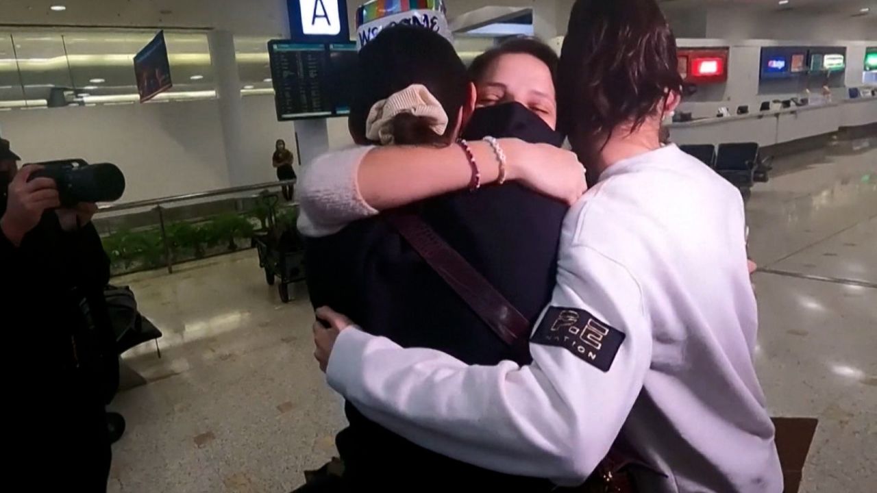 screengrab sydney airport women hugging