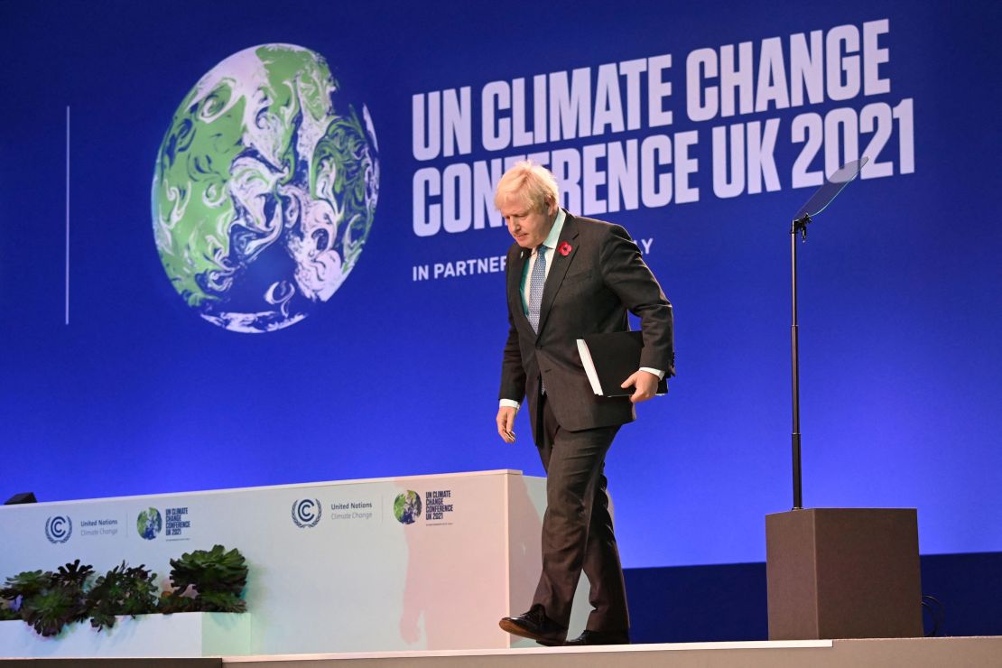 Boris Johnson walks off stage after speaking at the COP26 climate summit in Glasgow on November 1.