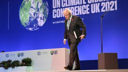 Britain's Prime Minister Boris Johnson walks off of the stage after speaking at the COP26 UN Climate Change Conference in Glasgow, Scotland on November 1, 2021. - COP26, running from October 31 to November 12 in Glasgow will be the biggest climate conference since the 2015 Paris summit and is seen as crucial in setting worldwide emission targets to slow global warming, as well as firming up other key commitments. (Photo by Jeff J Mitchell / POOL / AFP) (Photo by JEFF J MITCHELL/POOL/AFP via Getty Images)