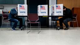 Voters fill out their ballots at an early voting center at the Mount Vernon Governmental Center on October 31, 2020 in Alexandria, Virginia. Today is the final day of early voting in Virginia, with voters waiting hours in line to cast their ballots ahead of the presidential election on Tuesday. 