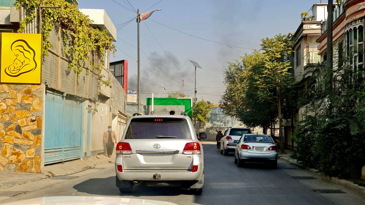 Smoke rises from the site of blasts at a hospital in Kabul on Tuesday. 