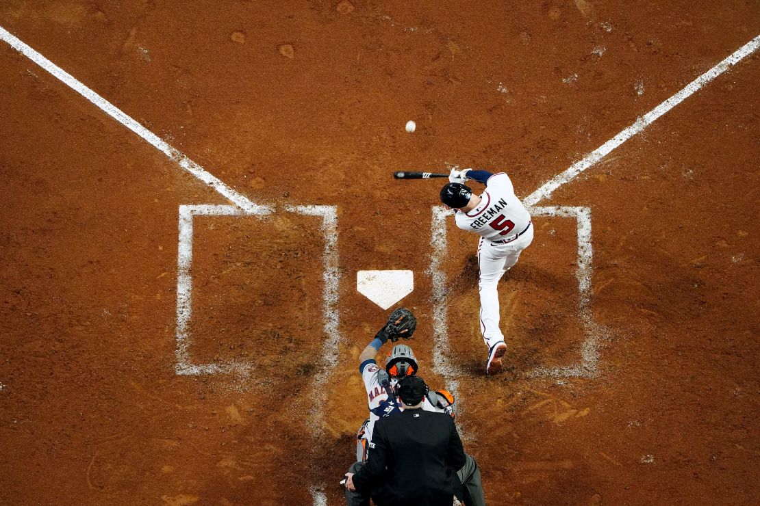 Freddie Freeman of the Braves hits a solo homer in the third during Game 5.