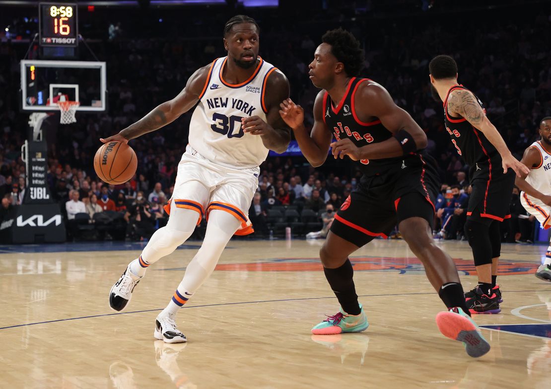 The Knicks' Julius Randle drives against OG Anunoby.