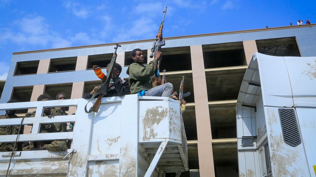 Tigrayan forces parade captured Ethiopian government soldiers and allied militia members in open-top trucks, as they are taken to a detention center in Mekele on October 22.