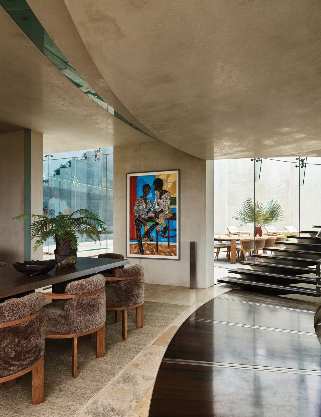 An artwork by Nigerian American artist Toyin Ojih Odutola hangs in the family dining room.