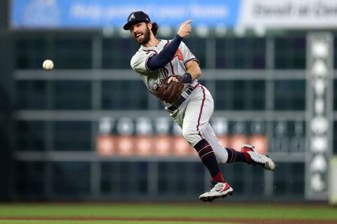 Braves shortstop Dansby Swanson throws a runner out.