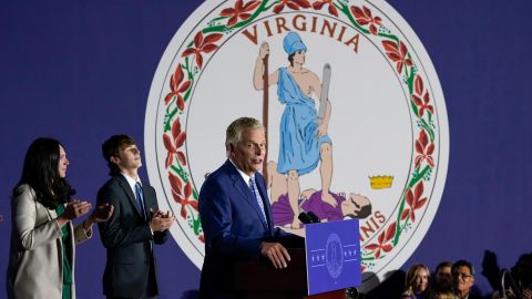 Democratic gubernatorial candidate Terry McAuliffe gestures as he speaks in front of the flag of Virginia at an election night party in McLean, Va., Tuesday, Nov. 2, 2021. 