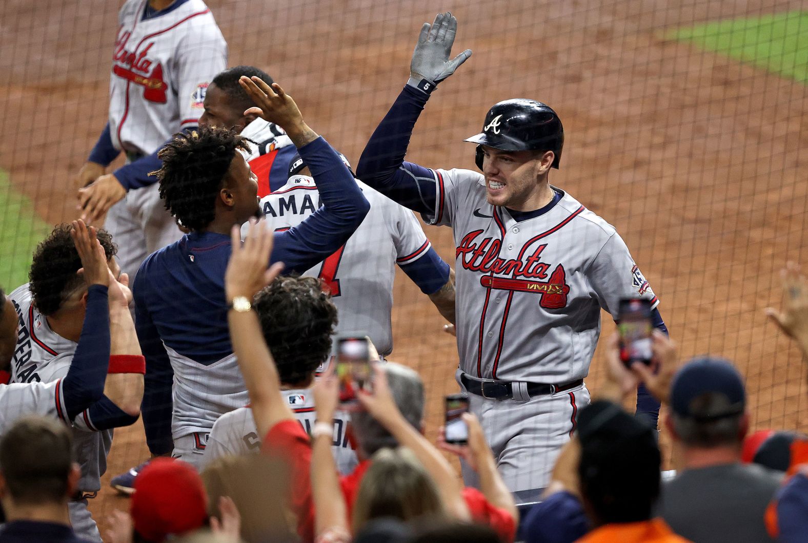 Braves first baseman Freddie Freeman celebrates with his teammates after <a  target="_blank">hitting a solo home run.</a>