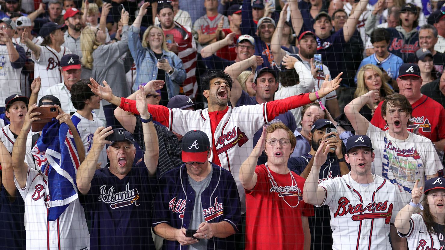 Fans celebrate the Atlanta Braves' 7-0 victory over the Houston Astros Tuesday to win the 2021 World Series.