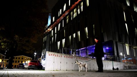 A man stands in front of the Uppsala Konsert & Kongress venue.