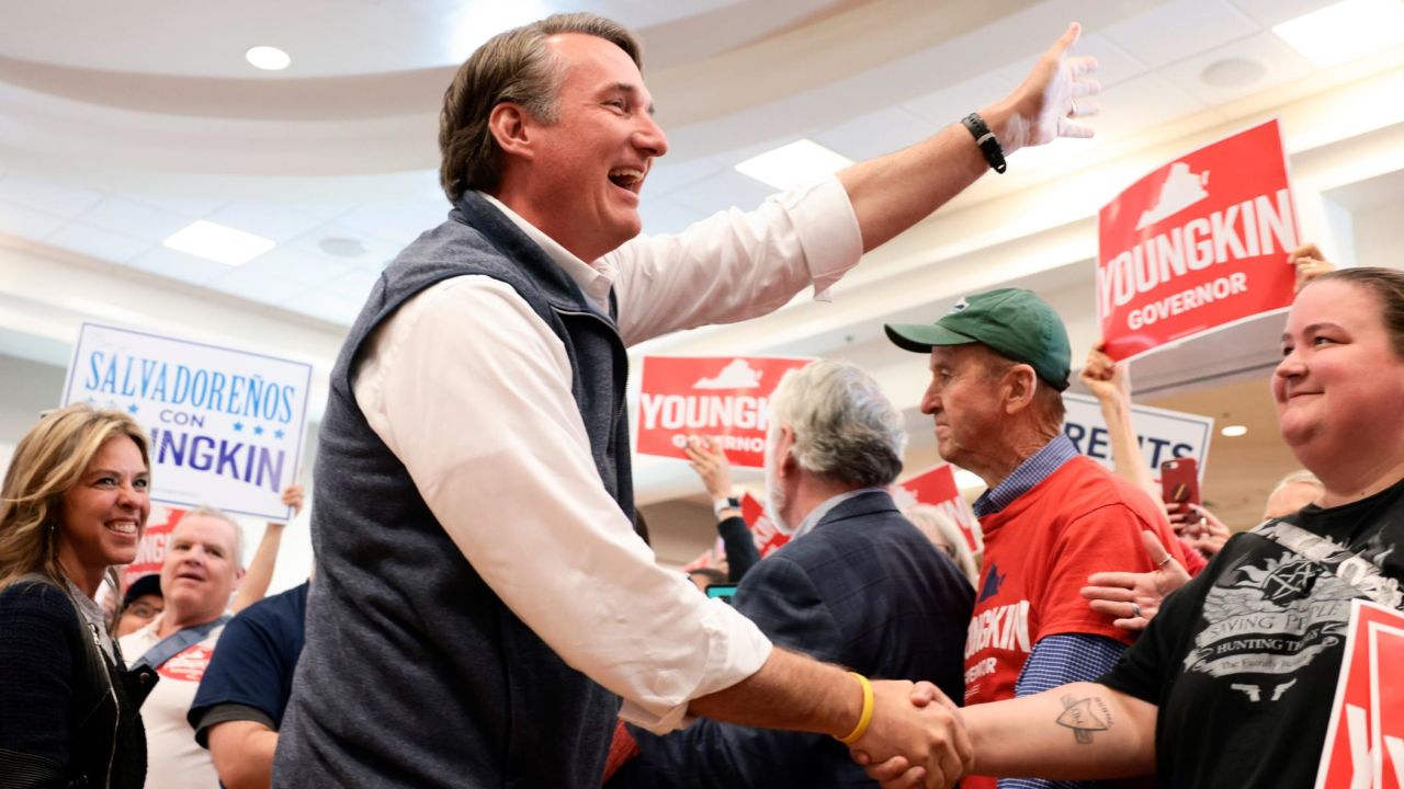 MANASSAS, VIRGINIA - OCTOBER 30: Virginia Republican gubernatorial candidate Glenn Youngkin and Suzanne Youngkin greet supporters as they arrive to a campaign event October 30, 2021 in Manassas, Virginia. Youngkin is on the last few days of his campaign bus tour across the state of Virginia as he contests Democratic candidate and former Virginia Gov. Terry McAuliffe in the state election that is less than a week away on November 2. (Photo by Anna Moneymaker/Getty Images)