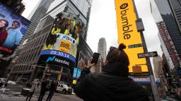 Monitors display Bumble Inc. signage during the company's initial public offering (IPO) in front of the Nasdaq MarketSite in New York, U.S., on Thursday, Feb. 11, 2021. Bumble Inc., the dating app where women make the first move, is targeting to raise as much as $1.8 billion from its U.S. initial public offering after boosting the size of the deal. Photographer: Michael Nagle/Bloomberg via Getty Images