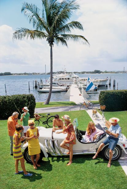 Kleenex heir Jim Kimberly (far left, in orange) talks with friends on the shores of Lake Worth, Florida in 1968.