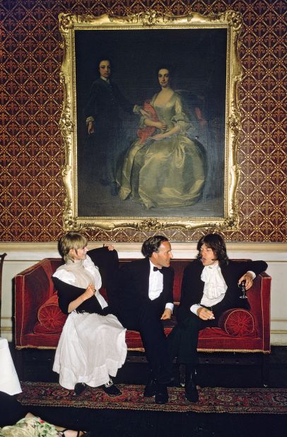 Singer Marianne Faithfull, author Desmond Guinness and Rolling Stones singer Mick Jagger attend a party at Castletown House, Ireland.