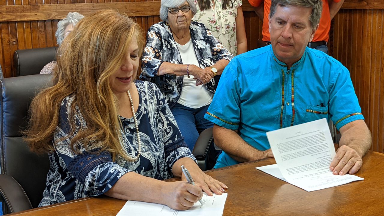 Presidio County Judge Cinderela Guevara and Mayor John Ferguson at a ceremony this week to transfer ownership of a cemetery back to the Lipan Apache Tribe of Texas.