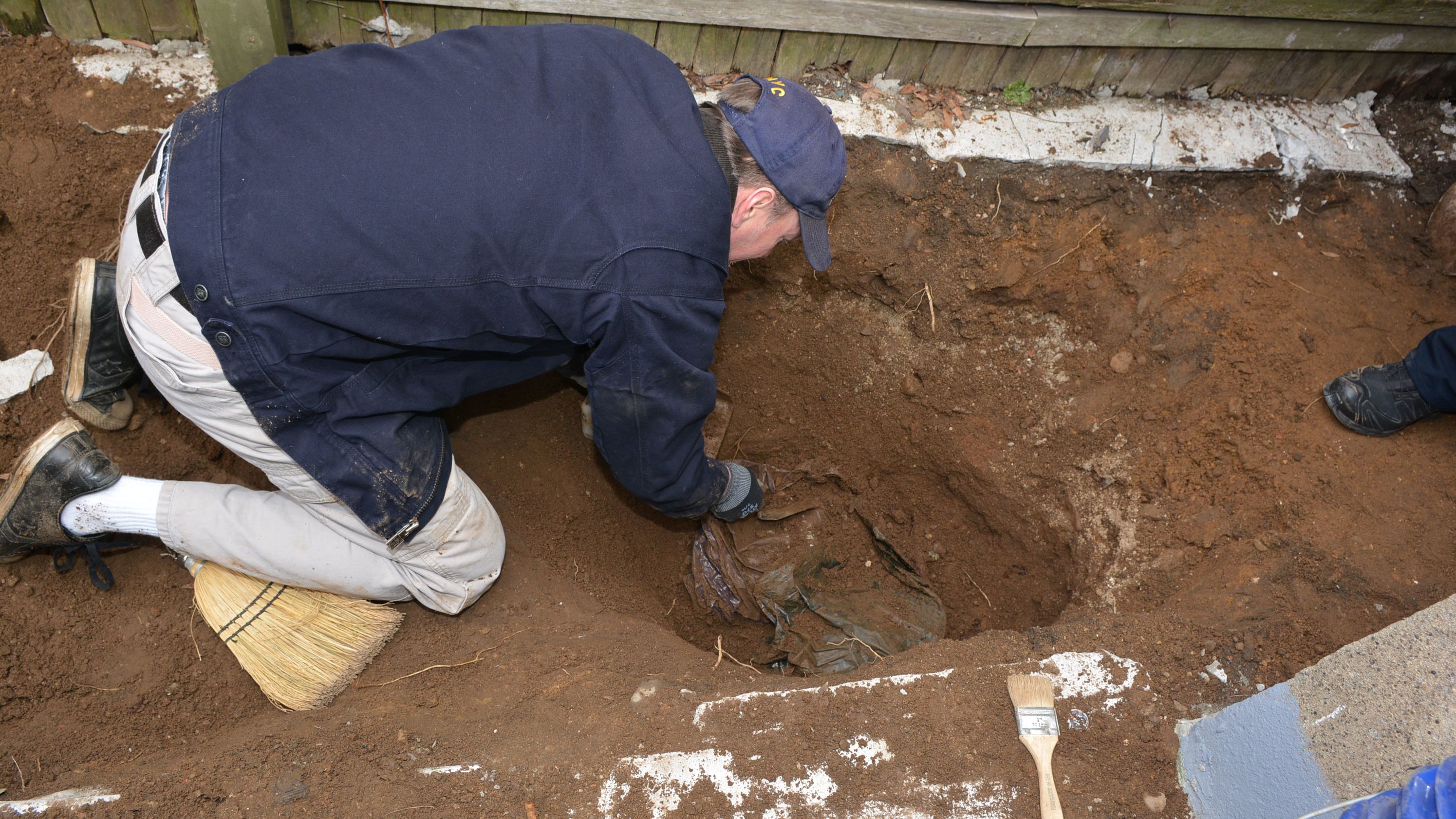 Human remains were discovered buried under concrete in a backyard in Queens in March 2019.