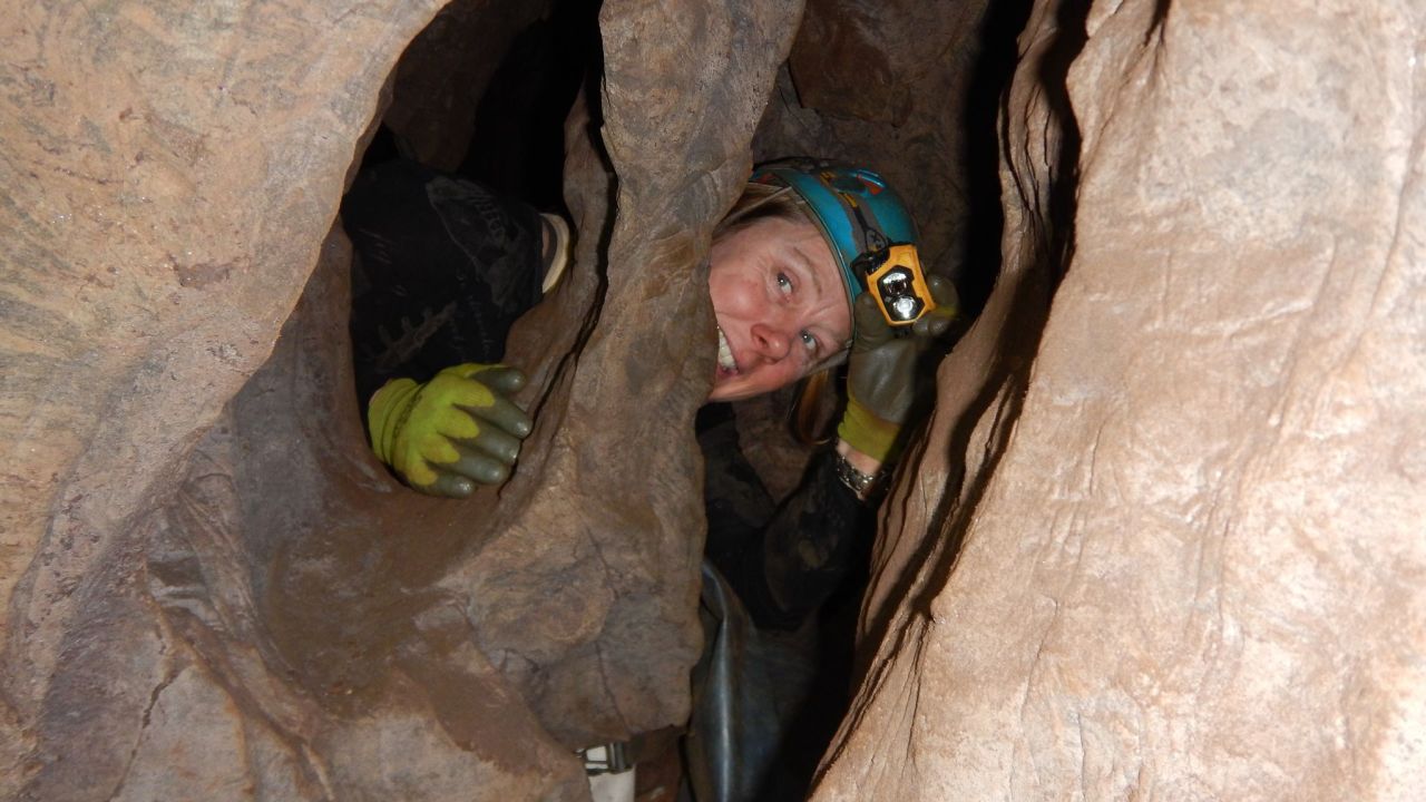 Marina Elliott is shown exploring the Rising Star cave system.