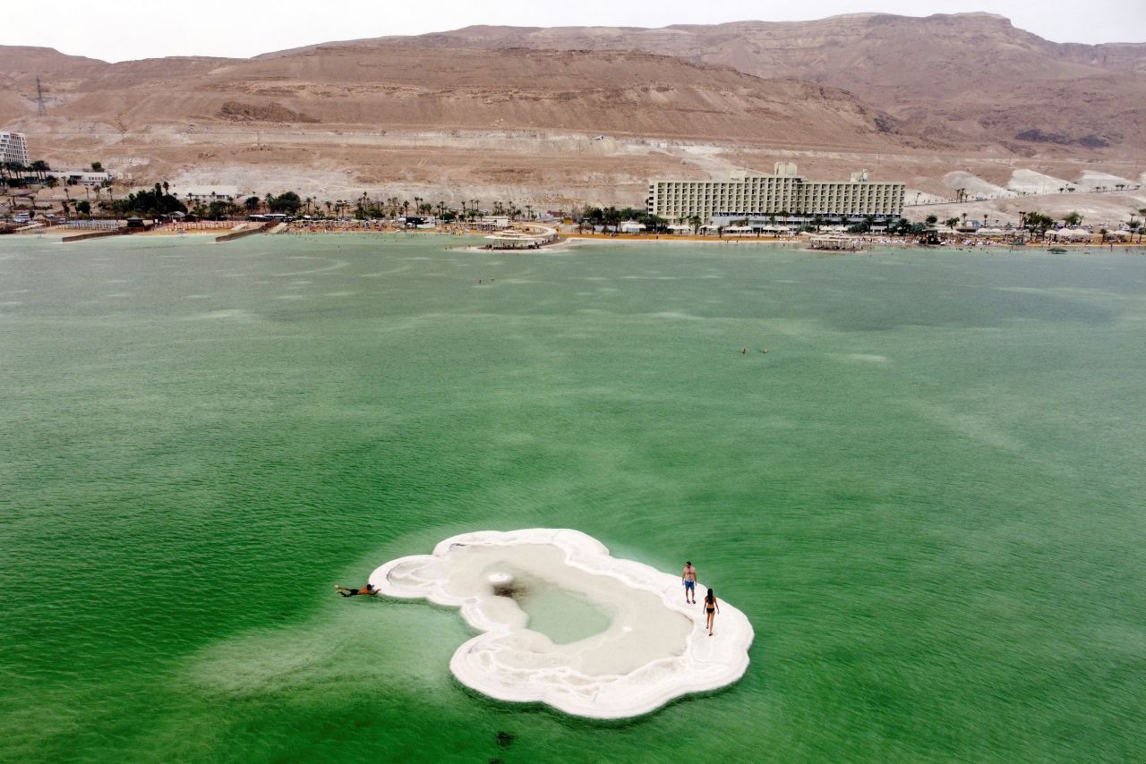 People explore a salt formation in the Dead Sea near Ein Bokek, Israel, on Saturday, October 30.