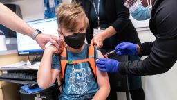 Registered Nurse Natasha McDannis inoculates Otto Linn-Walton, 8, with the first dose of the Pfizer-BioNTech COVID-19 vaccine for children five to 12 years at NYC Health + Hospitals Harlem Hospital, Thursday, Nov. 4, 2021, in New York. (AP Photo/Jeenah Moon)