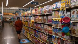 A customer walks through the cereal aisle at a Albertsons Cos. brand Safeway grocery store in Scottsdale, Arizona, U.S., on Monday, Oct. 18, 2021. Albertsons Cos. shares rose after the company posted a surprise gain in a key sales metric and raised its profit outlook. Photographer: Ash Ponders/Bloomberg via Getty Images