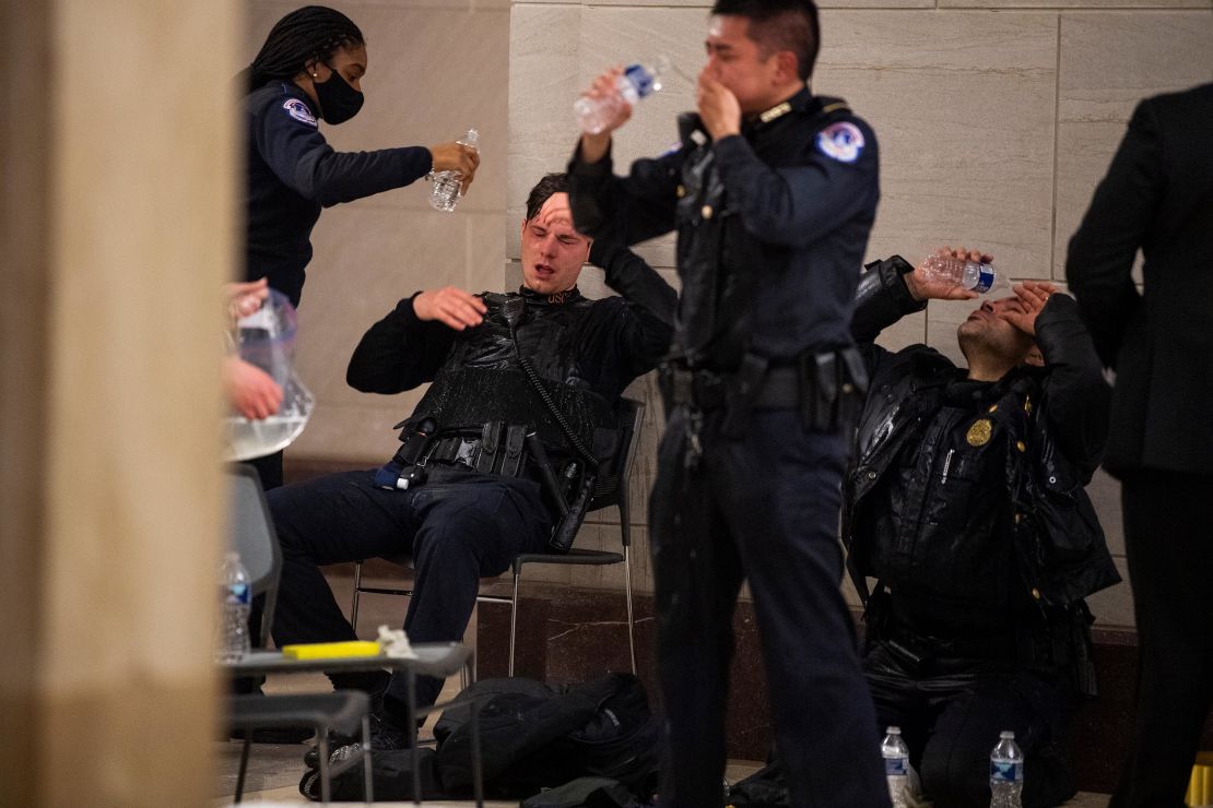 Capitol Police officers receive medical treatment after clashes with protesters on January 6, 2021.