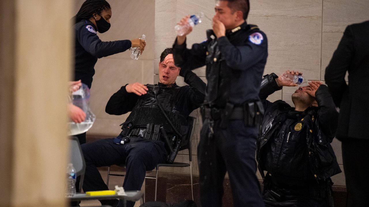 Capitol Police officers receive medical treatment after clashes with protesters on January 6, 2021.