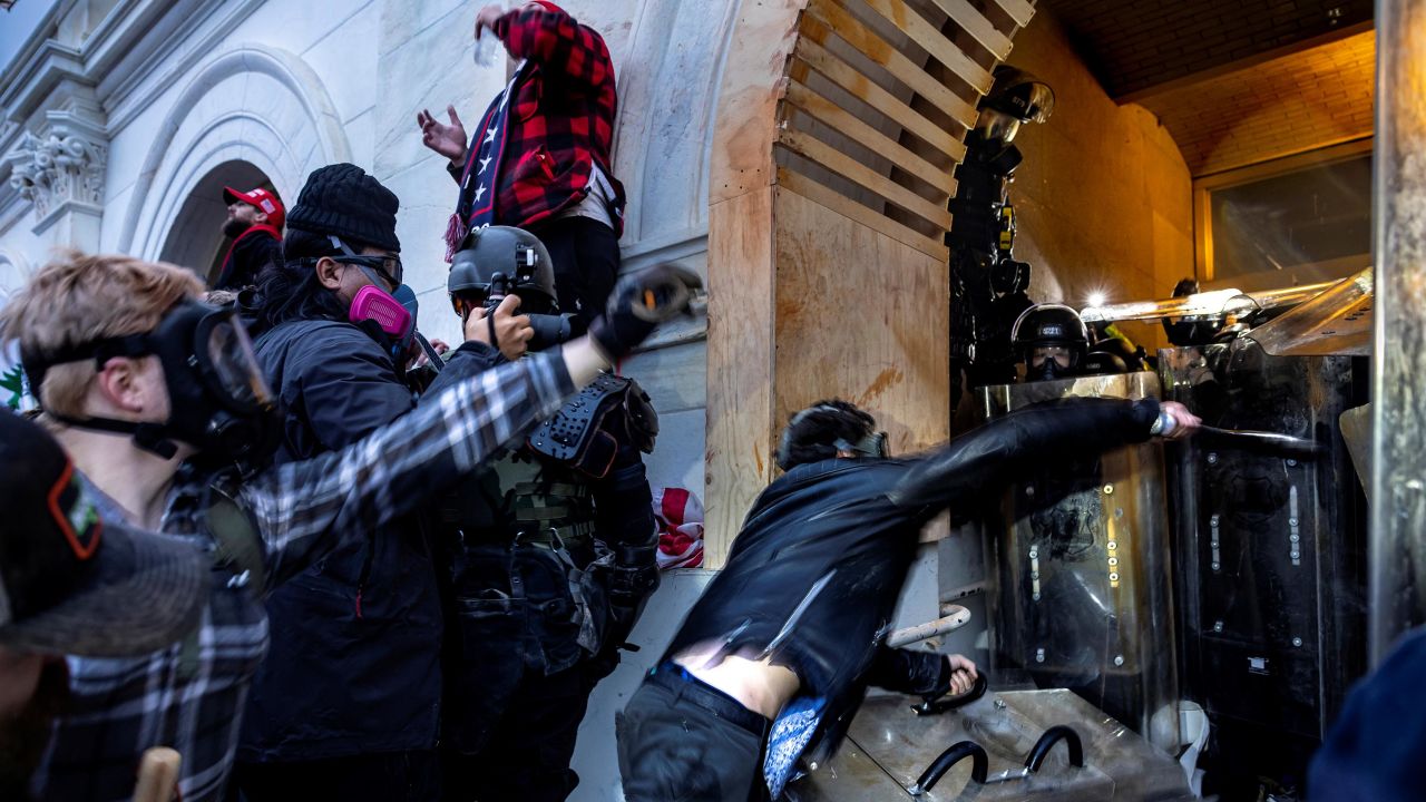 Trump supporters clash with police and security forces as people try to storm the US Capitol on January 6, 2021 in Washington, DC.