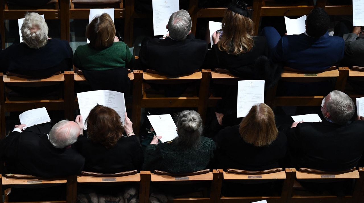 Guests attend the funeral, which was closed to the public.