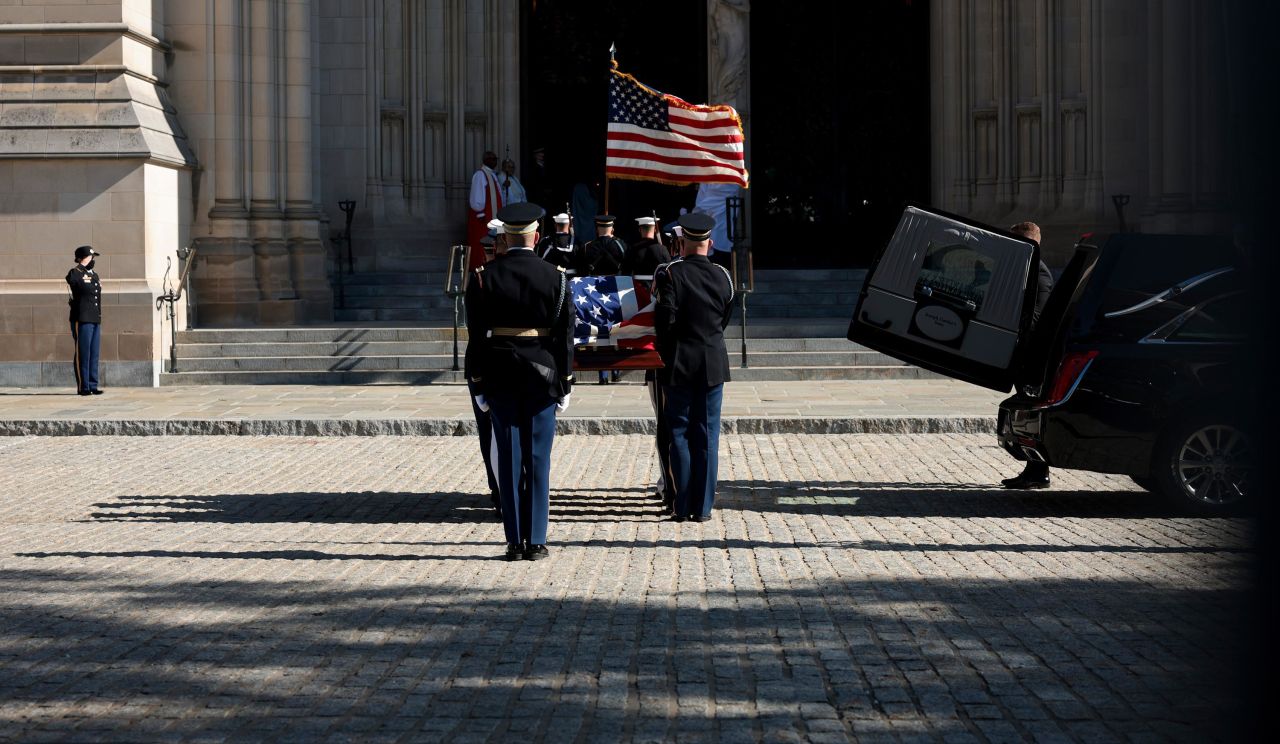 Powell is carried ahead of his funeral service.