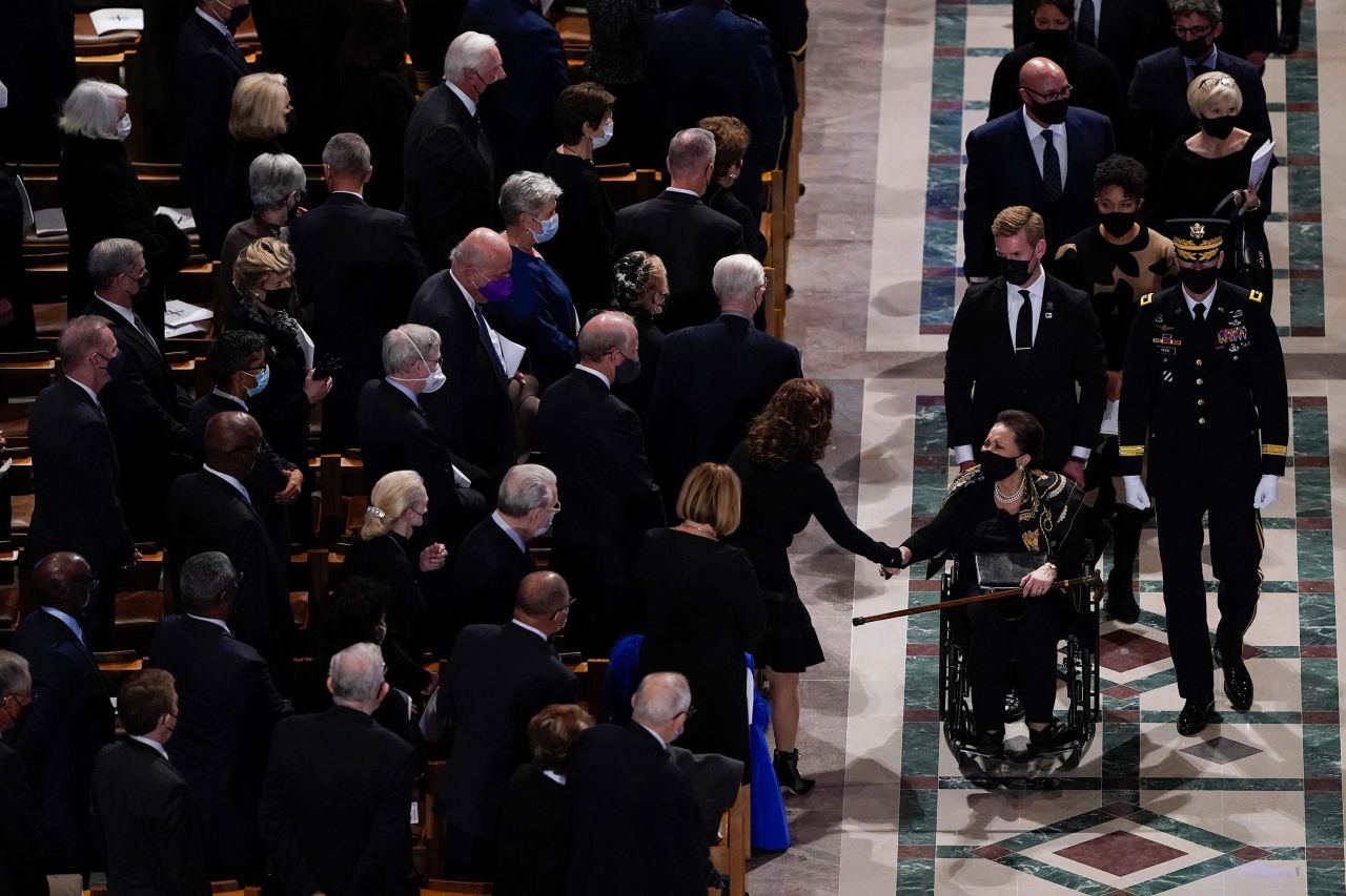 Alma Powell acknowledges people at the end of her husband's funeral at Washington National Cathedral.