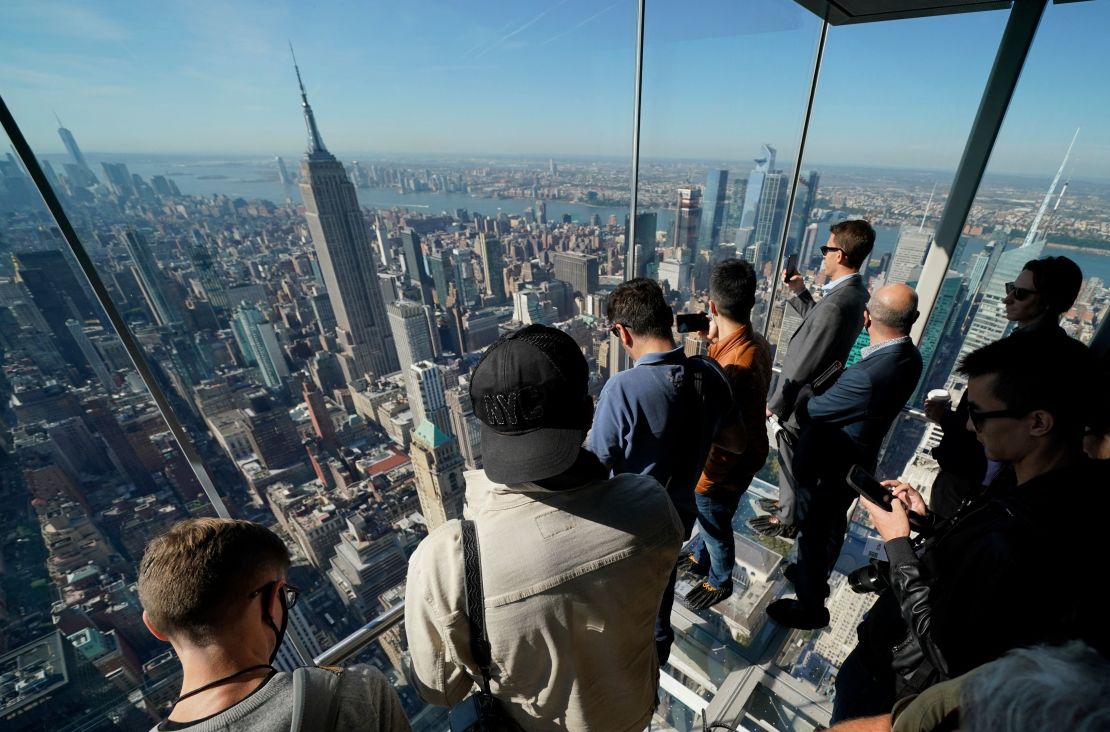 Visitors to the new Summit One Vanderbilt observatory in New York ride up a glass elevator on October 21.