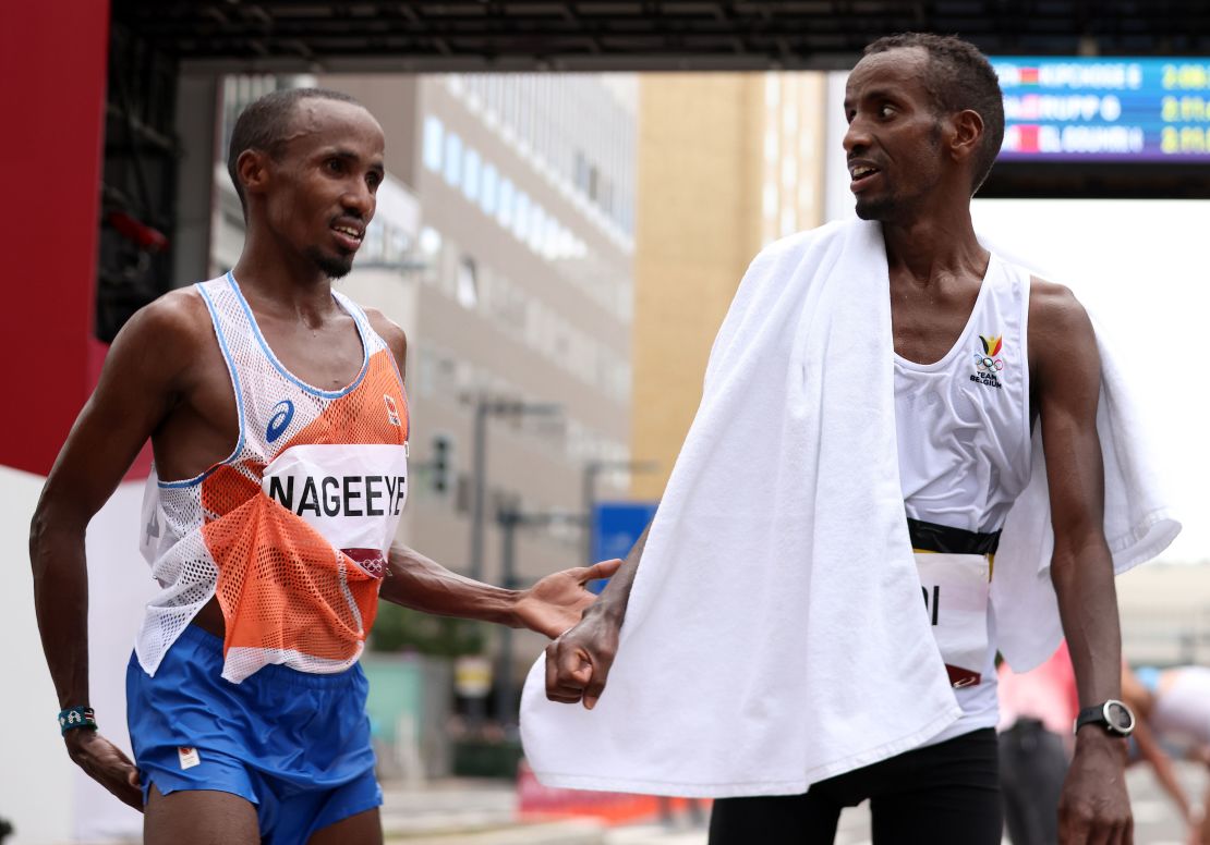Nageeye and Abdi talk at the end of the men's Olympic marathon in Sapporo. 
