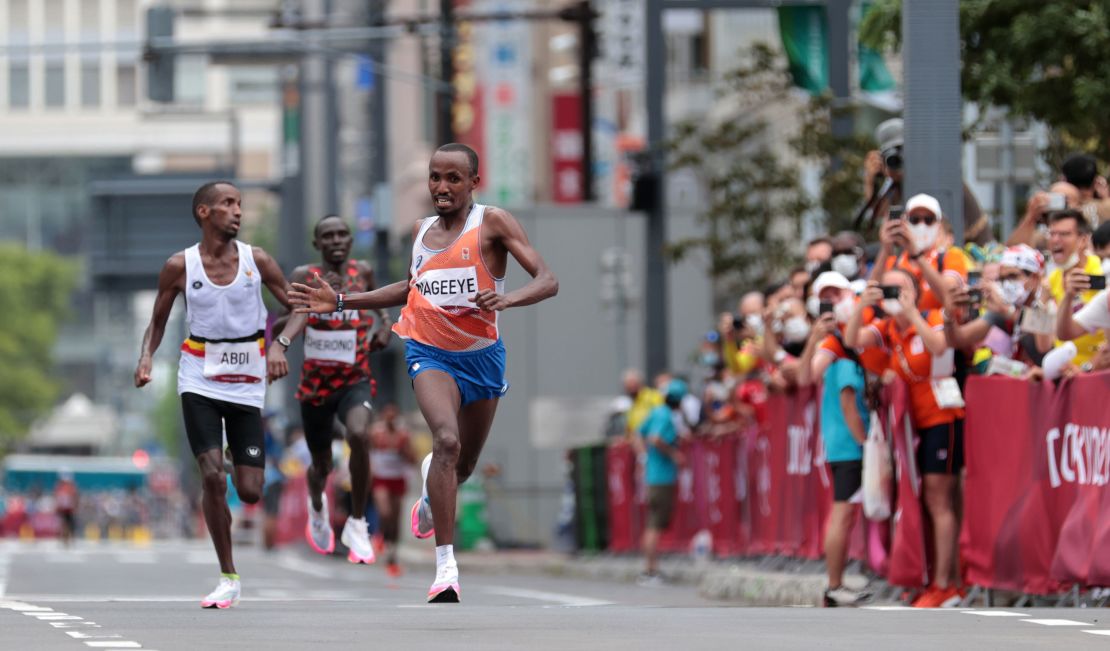 Nageeye urges Abdi towards the finish line of the Olympic marathon.  
