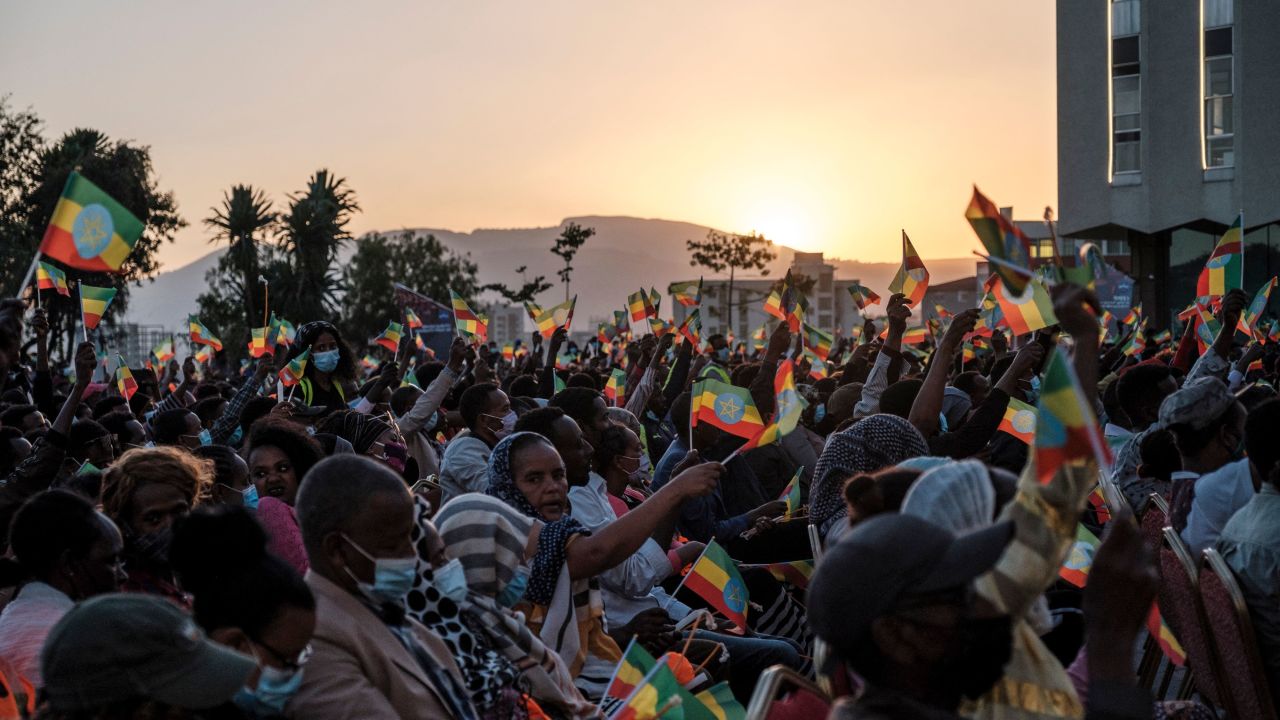 A crowd hold Ethiopian flags during a memorial service for the victims of the Tigray conflict organized by the city administration, in Addis Ababa, Ethiopia, on November 3, 2021. (Photo by EDUARDO SOTERAS / AFP) (Photo by EDUARDO SOTERAS/AFP via Getty Images)