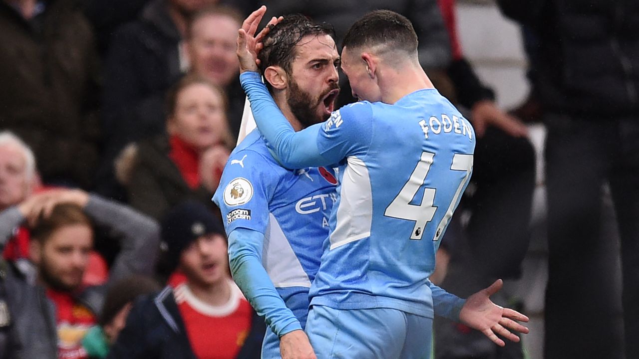 Bernardo Silva (left) celebrates scoring Man City's second goal.