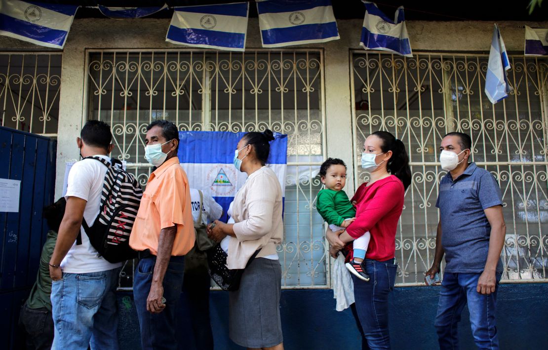 People wait in line to vote during Nicaragua's general election, at a polling station in Managua on November 7.