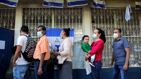 People wait in line to vote during Nicaragua's general election, at a polling station in Managua on November 7.