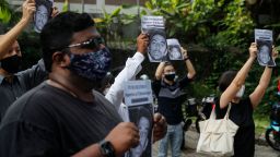 Activists hold posters of Nagaenthran K. Dharmalingam, who was convicted of a drug offence 10 years ago in Singapore but diagnosed as intellectually disabled, before submitting a memorandum to Parliament in Kuala Lumpur, Malaysia, 03 November 2021.