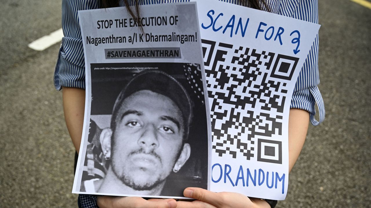 An activist holds a placard before submitting a memorandum to parliament in protest at the impending execution of Nagaenthran K. Dharmalingam, in Kuala Lumpur on November 3.